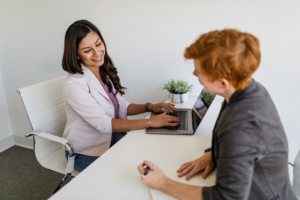 Two women meeting at desk